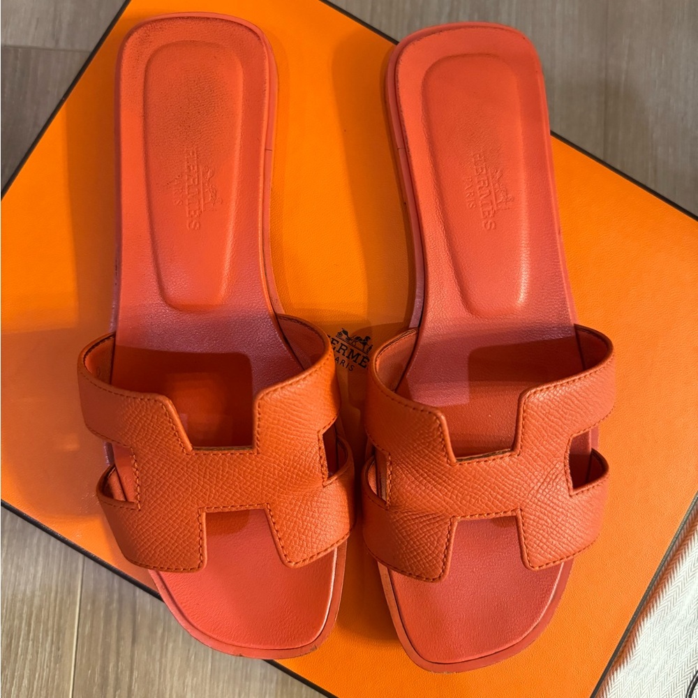 Authentic Hermes Orange Sandal. Worn shoes but in a wearable condition.
